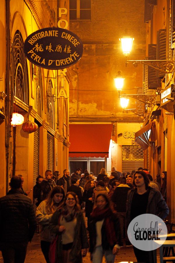 Crowds fill up Bologna's historic center going to local restaurants and bars.